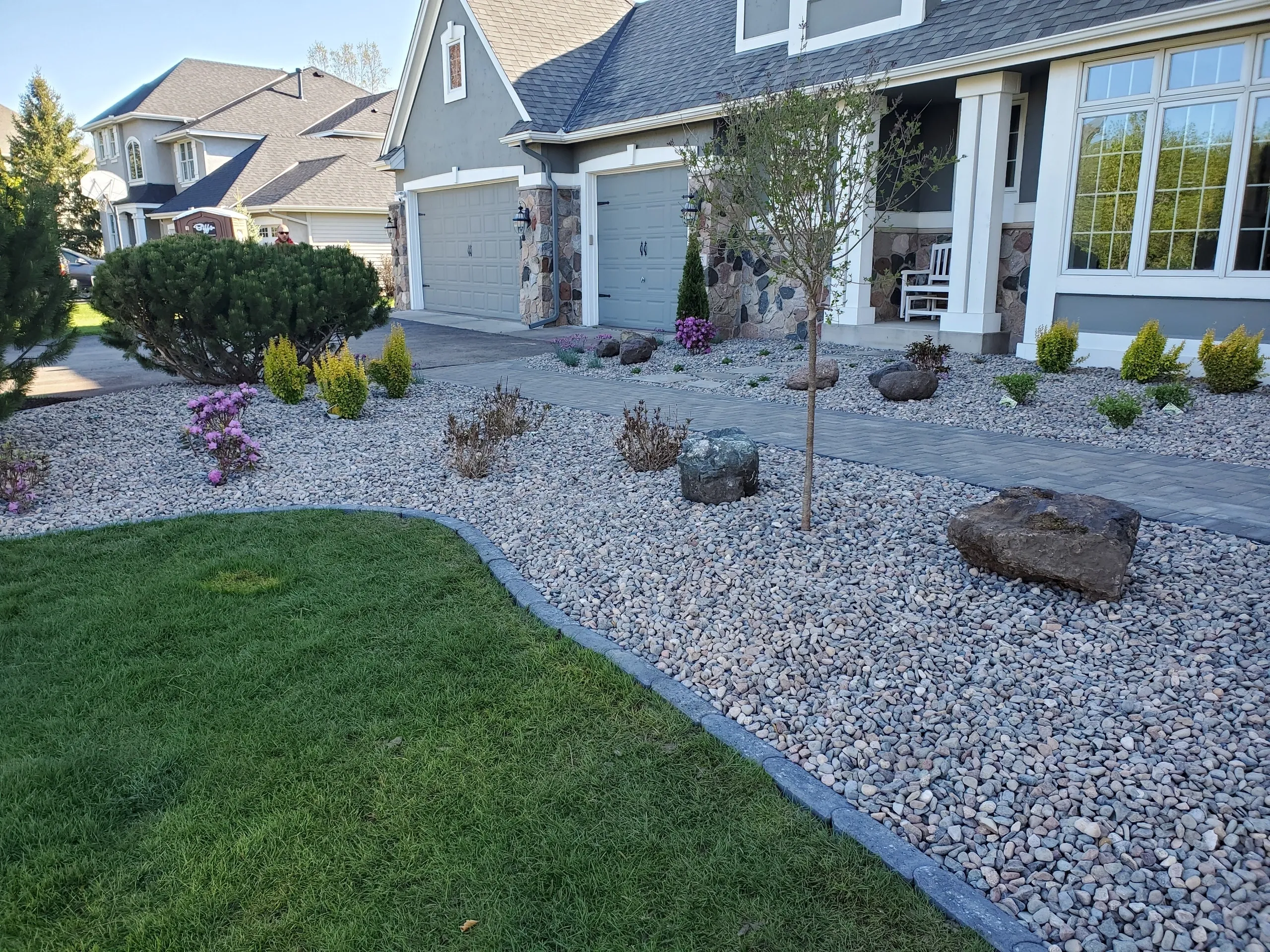 A house with a lot of rocks in the yard