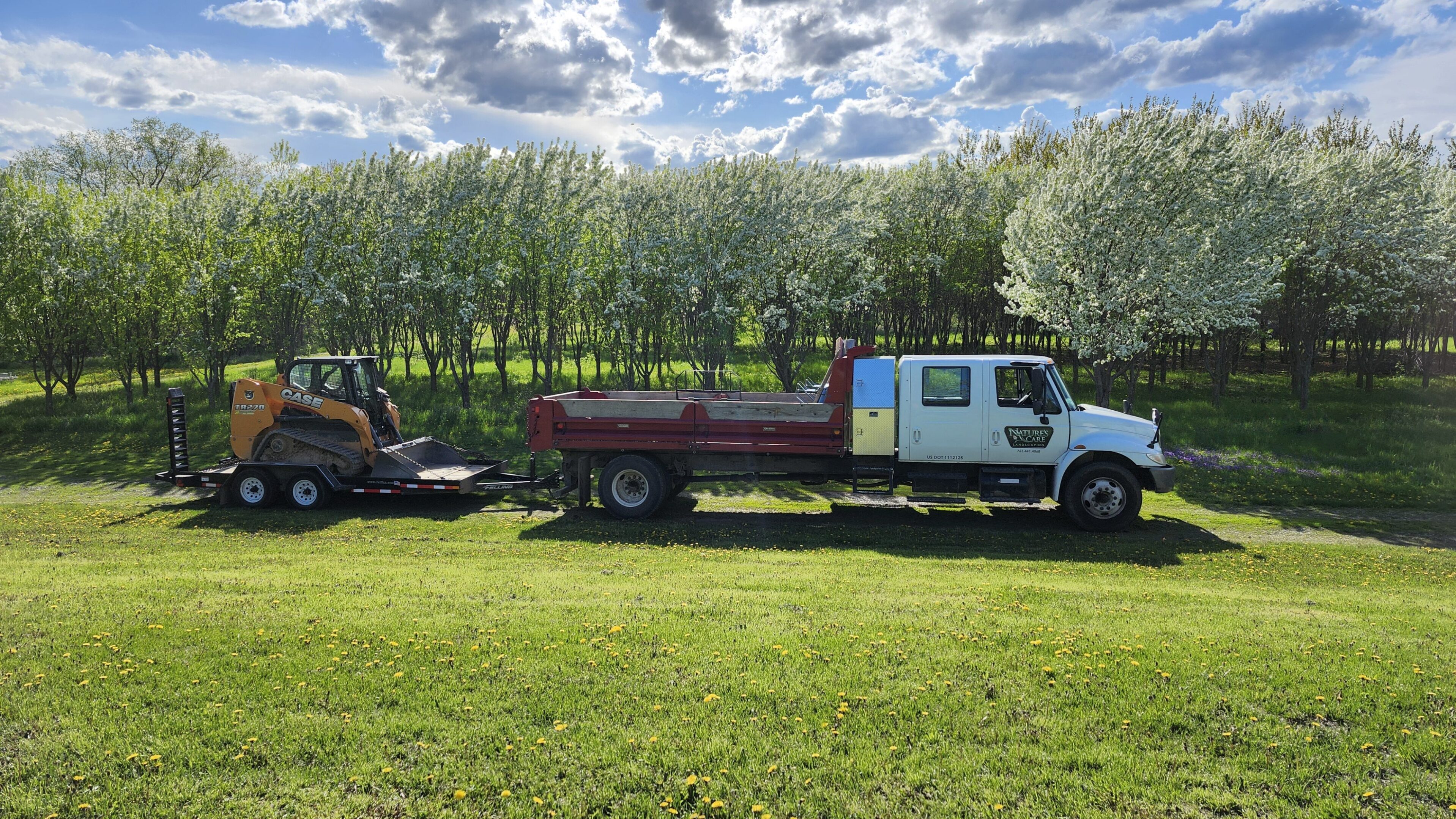 A truck is towing a trailer behind it.