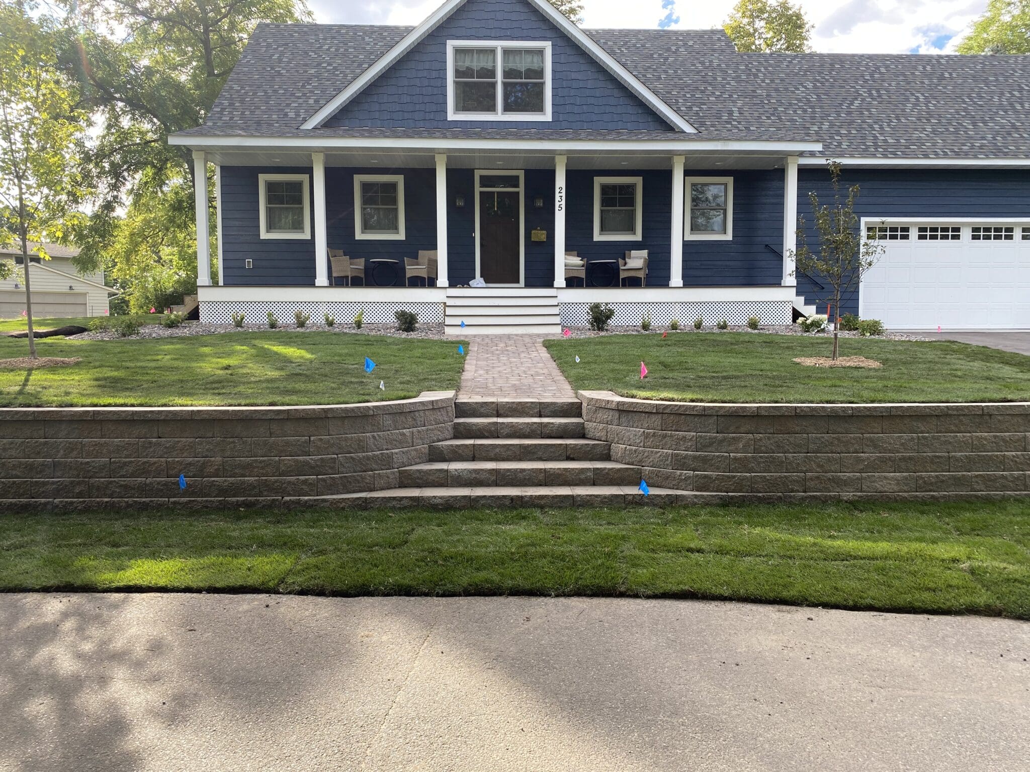 A house with steps leading to the front door.